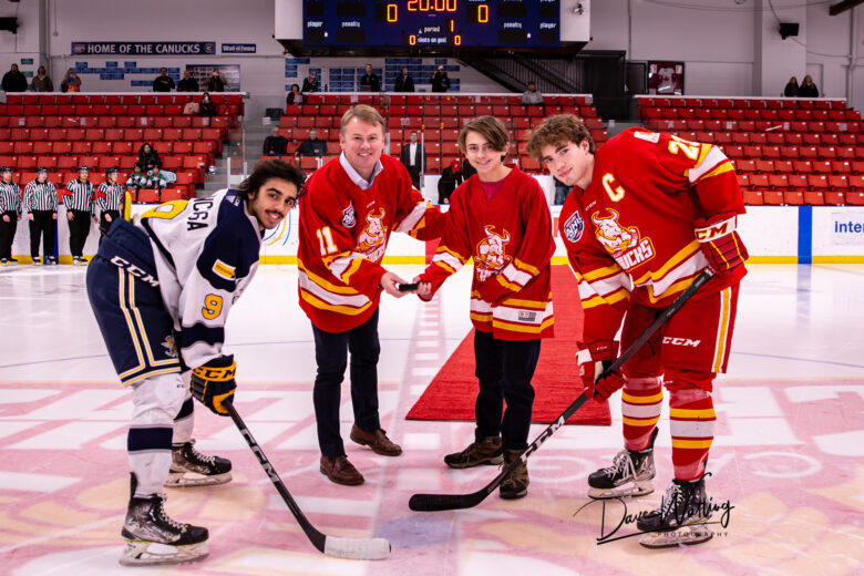 MLA and Justice Minister Tyler Shandro drops the puck with Captain Justin Barker during Calgary Canucks Dec. 10 game against the Spruce Grove Saints