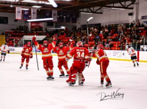 Calgary Canucks celebrate after clinching their place in the 2024 AJHL finals